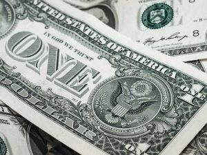 dollar bills in a pile